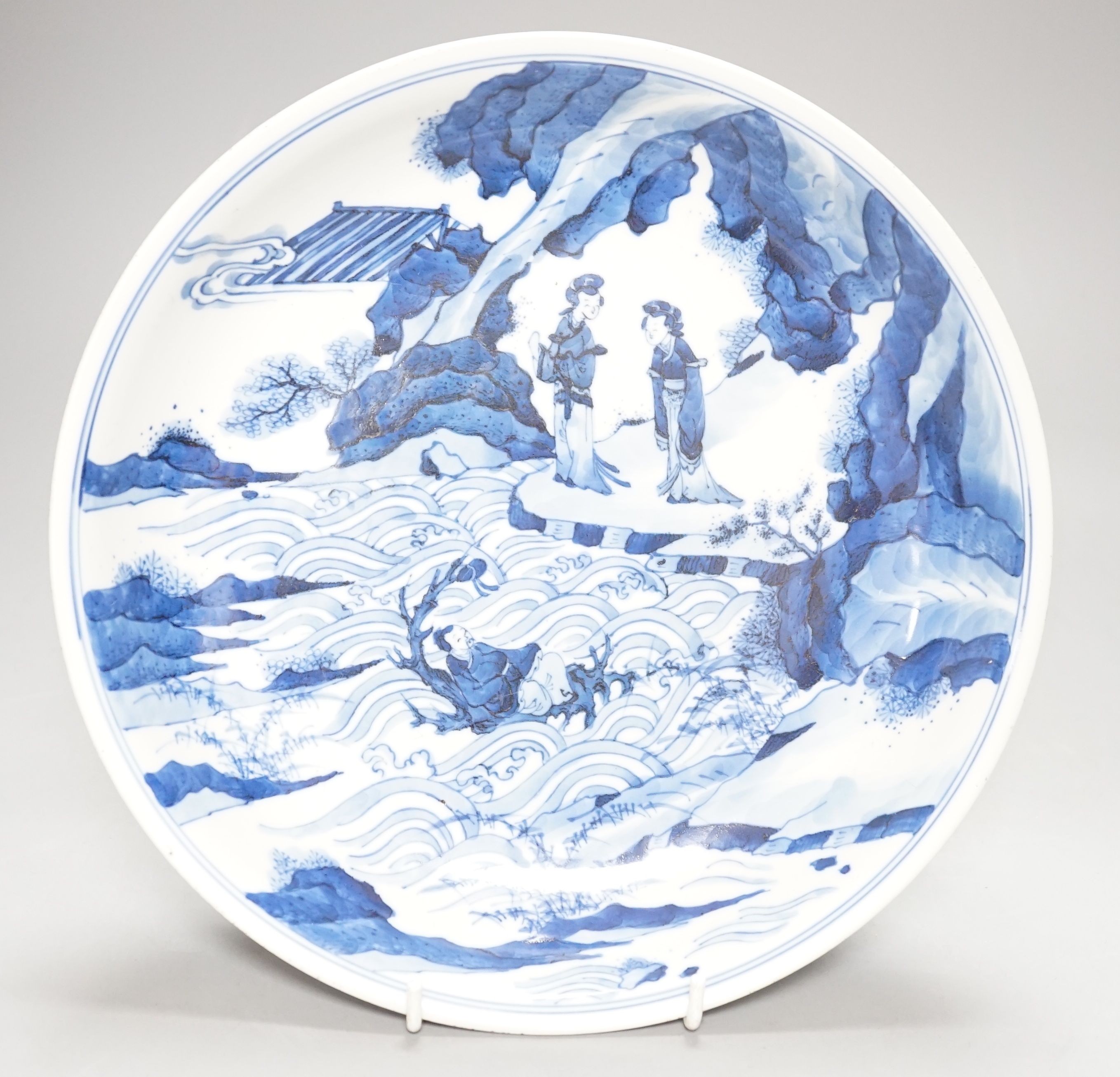A Chinese blue and white dish, painted with figures, 27cm